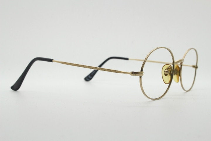Giorgio Armani 90s vintage oval eye glasses made in Italy. 30s design gold optical frames in a satin finish. Prescription RX