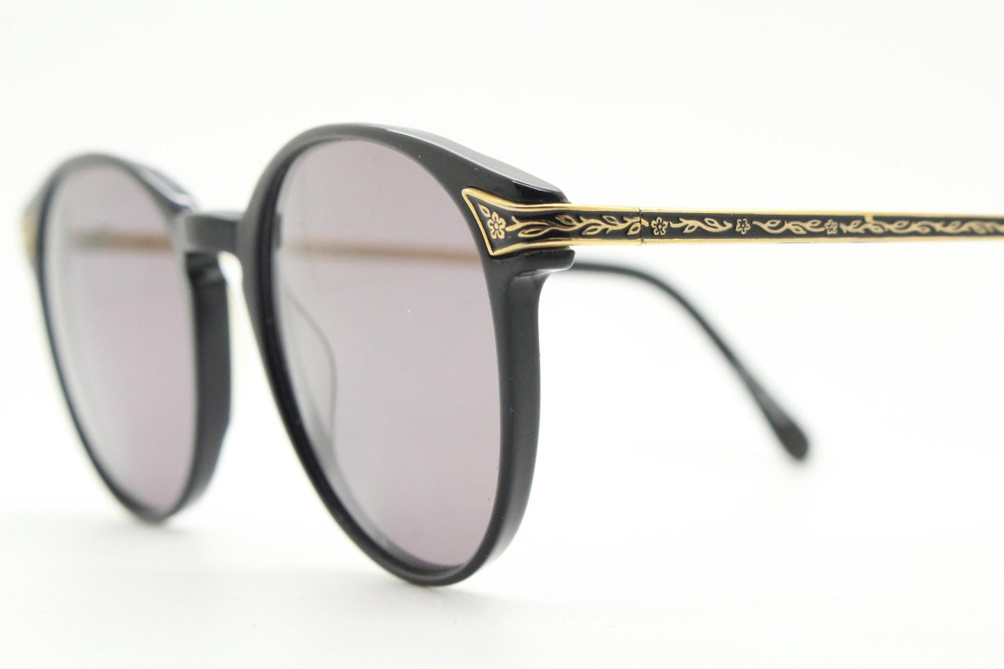 Laura Ashley 90s vintage round sunglasses. Refined 1940s design in black acetate with ornate embossed metal arm details. Unused NOS