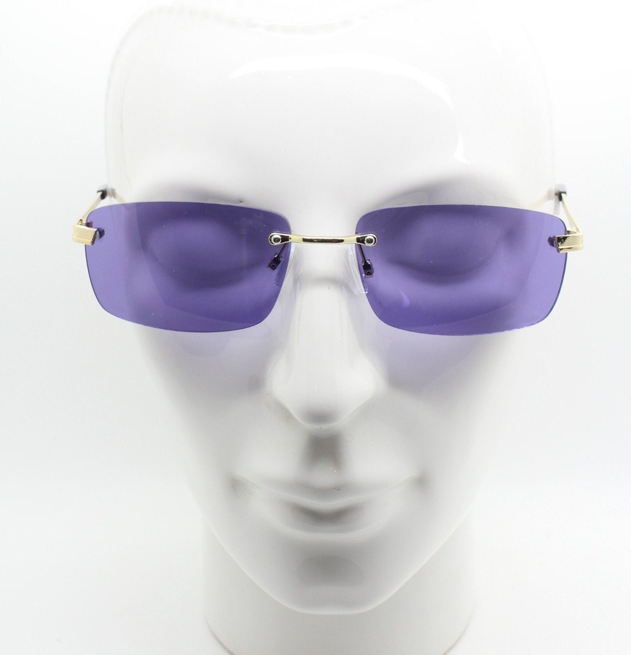 Y2K vintage frameless purple sunglasses. Rectangular lenses with gold bridge and arms. 2000s club kids. 00's. 90s Rave