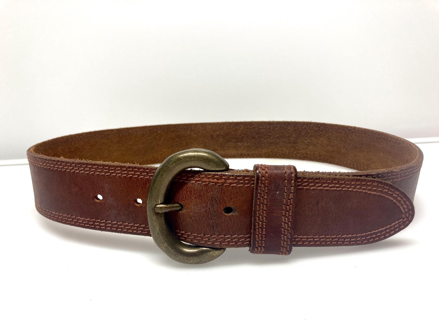 80s vintage jeans or trousers belt with brass buckle. Tan brown substantial single cut genuine leather construction with triple stitching