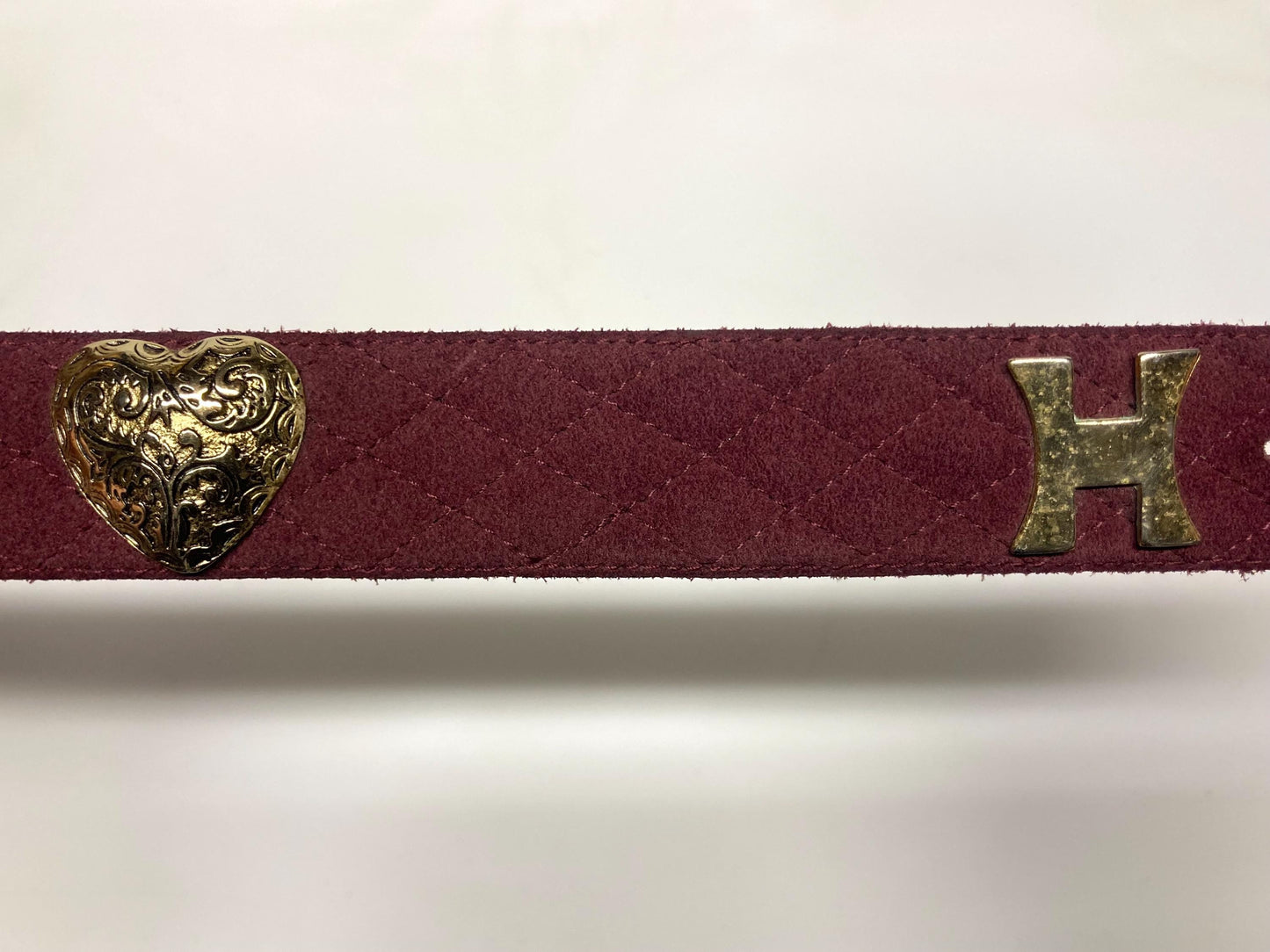 80s vintage womens dress belt in wine real suede with substantial covered buckle and gold domed hearts. Made in France by Chanon. NOS