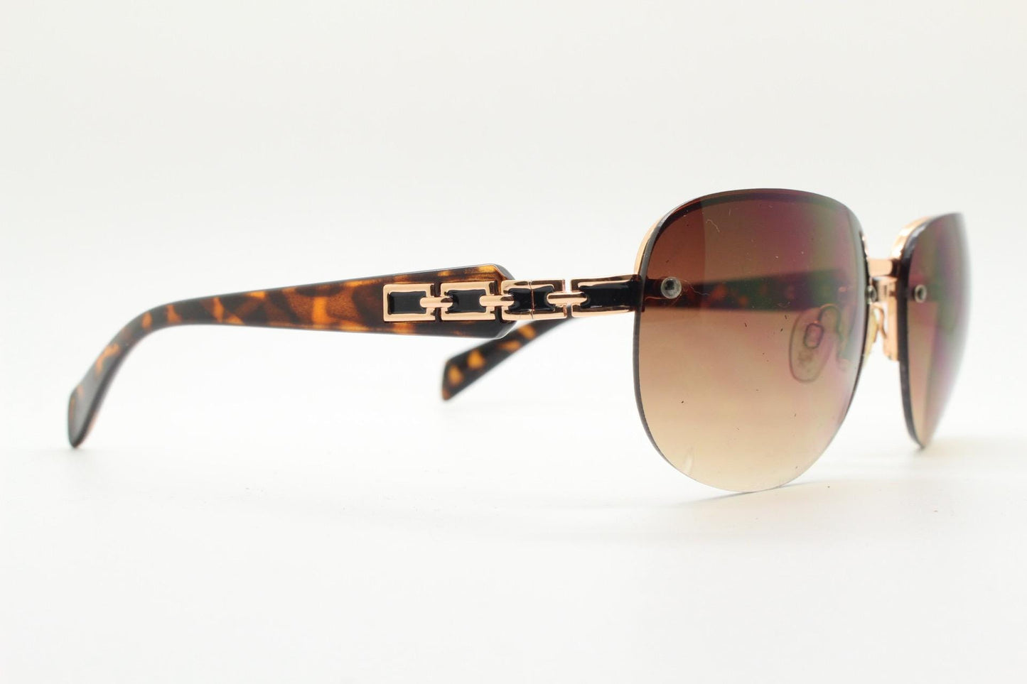 Y2K vintage rectangular brown sunglasses. Gold half frame with tortoise arms, chain link temples and graduating lenses. 2000's NOS