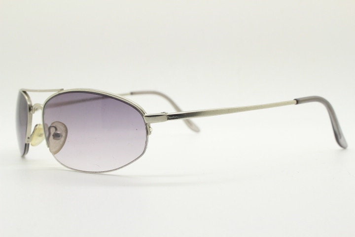 90s vintage modified extra small aviator sunglasses made in the USA. Satin finish solid metal frame aviators with light tone smoky lenses