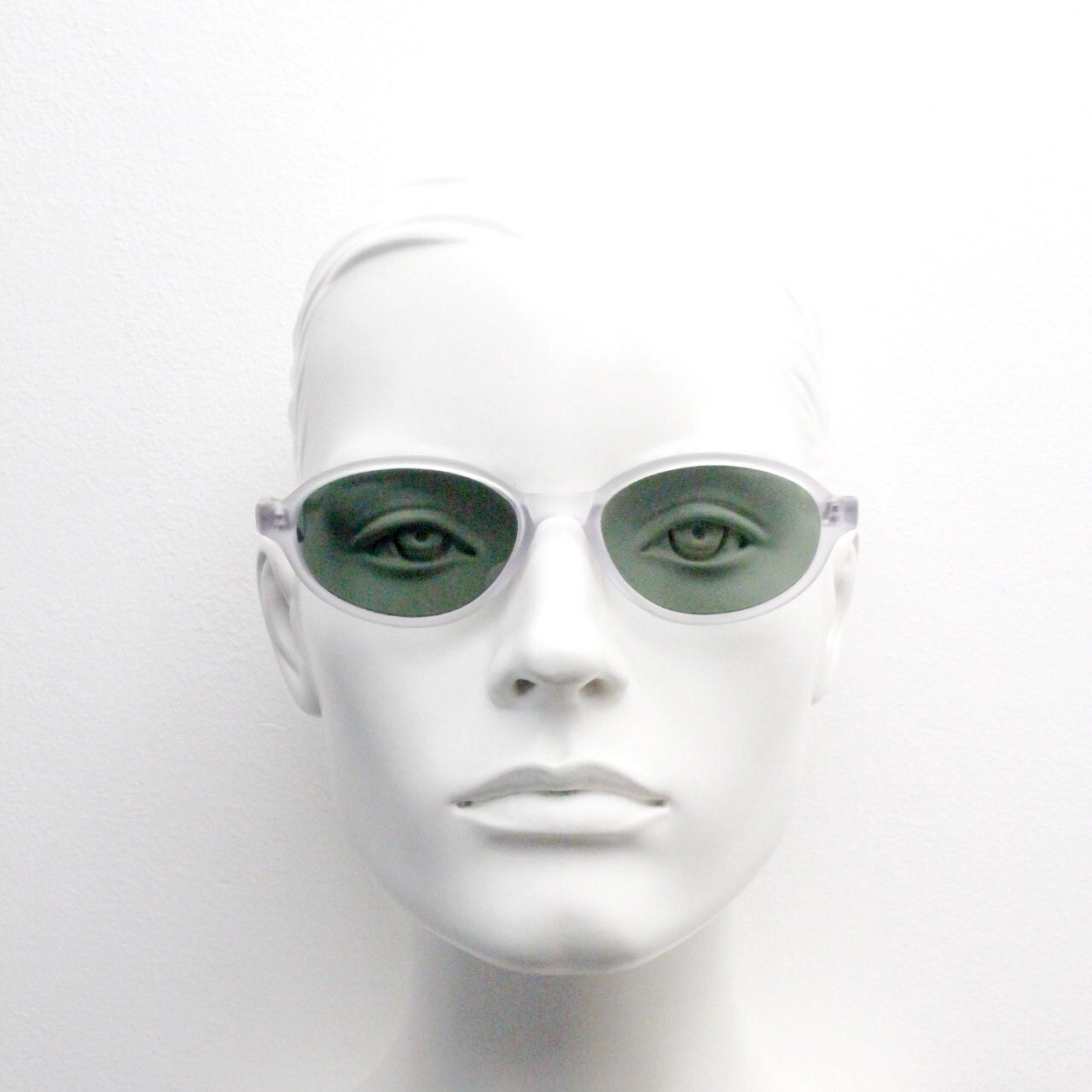 Vintage 90s futuristic oval sunglasses. Frosted transparent frame cat eye with dark green lenses. Unused NOS