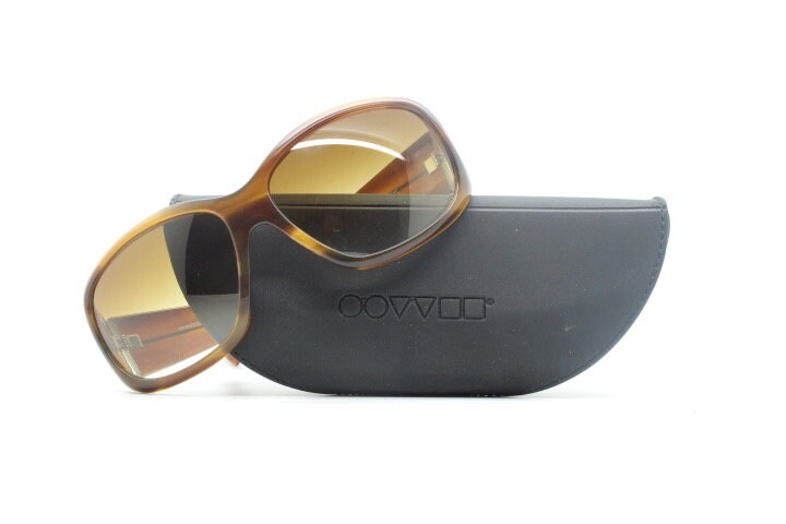 Oliver Peoples vintage Y2K wrap around sunglasses model Vanadis made in Japan. Big bug eye with tall arms in mottled brown acetate frame