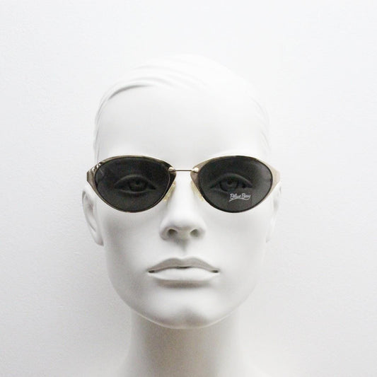 Blue Bay 90s vintage oval cat eye sunglasses made in Italy by Safilo. Dynamic gold chrome finish with contrasting dark lenses. NOS with tag