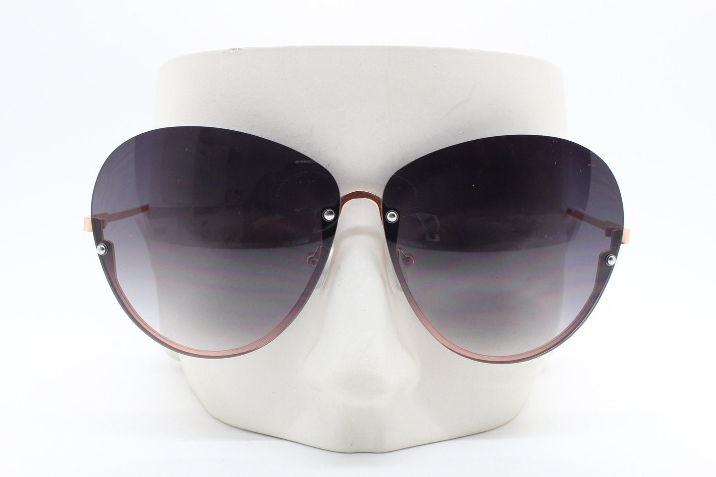 Y2K vintage large rimless sunglasses. Women's 70s style half frame design with graduating black lenses and gold arms. 2000s BNWT