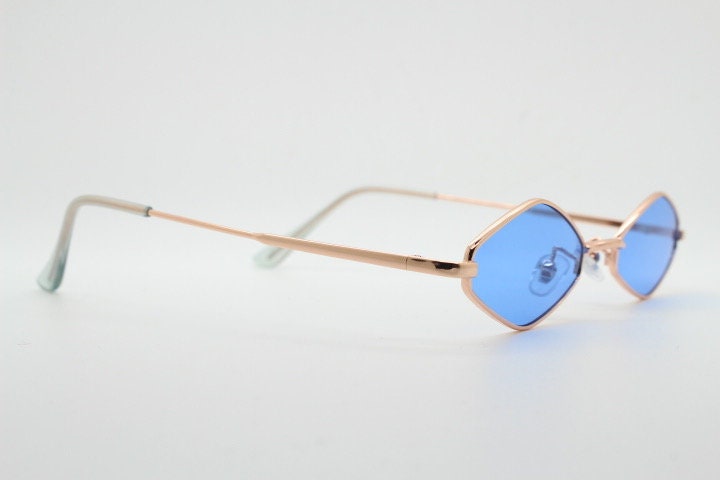90s vintage small diamond sunglasses. Minimal gold psychedelic mod style frame with sky blue lenses. Unused New Old Stock