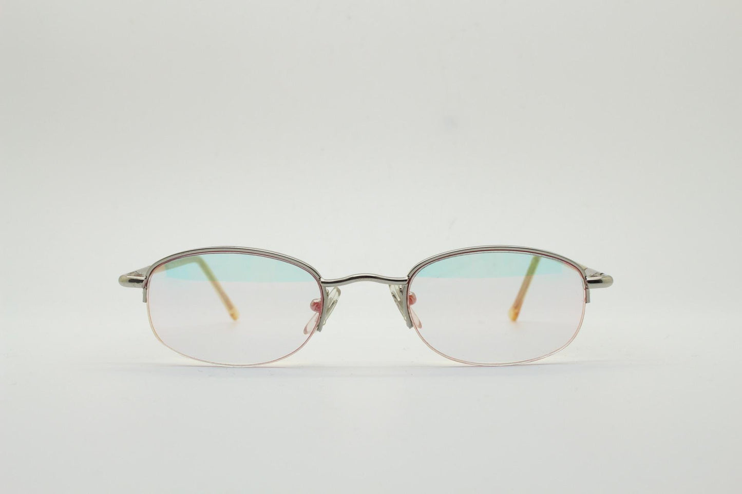 90s vintage small rectangular sunglasses. Silver chrome half frame with light tone lenses with gold mirror glaze. 2000's. Y2K. NOS micro
