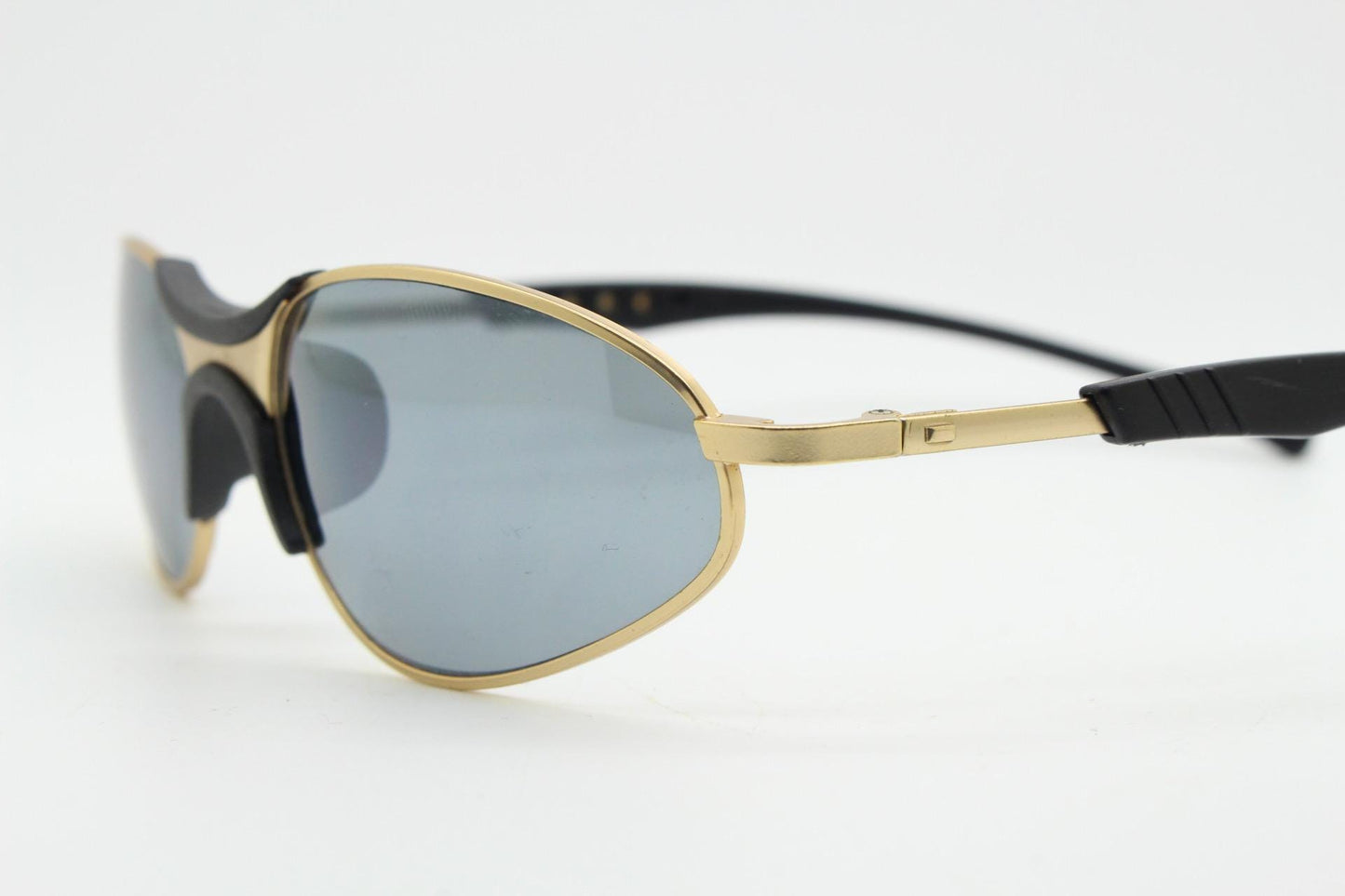 90s vintage oval small bug eye sunglasses. Curved gold satin finish metal frame with black matt trim and adjustable arm length. Unused NOS