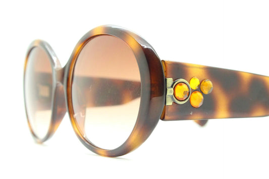 90s vintage round sunglasses. 60s style thick honey tortoise frame with graduating lenses and amber diamantes. Rhinestone. Unused NOS