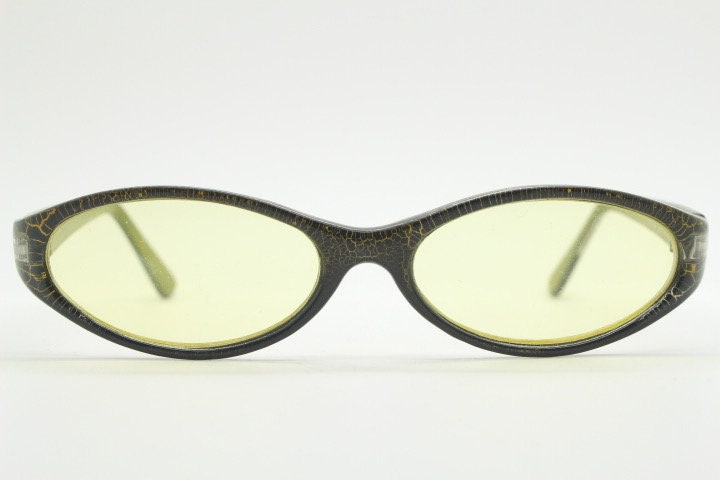 90s vintage abstract oval sunglasses. Thick curve around black frame with psychedelic yellow crackle print. Mini mask. Cosplay NOS