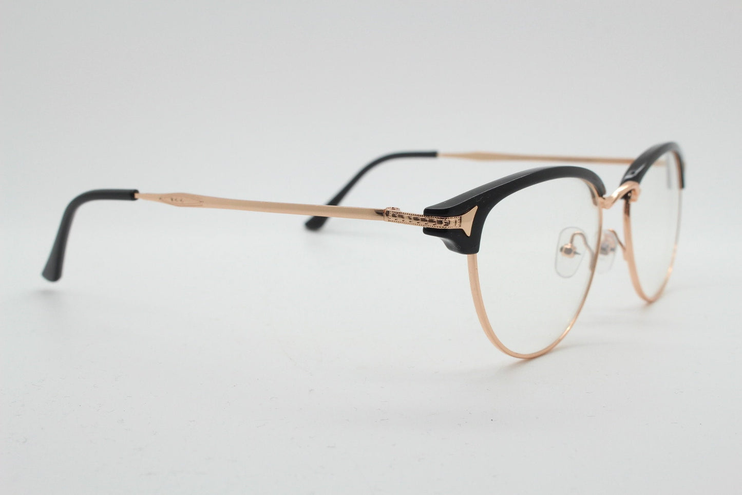 90s vintage browline cat eye glasses. Black gloss and gold half frame eyeglasses. 50s, 60s cateye design with clear lenses. NOS