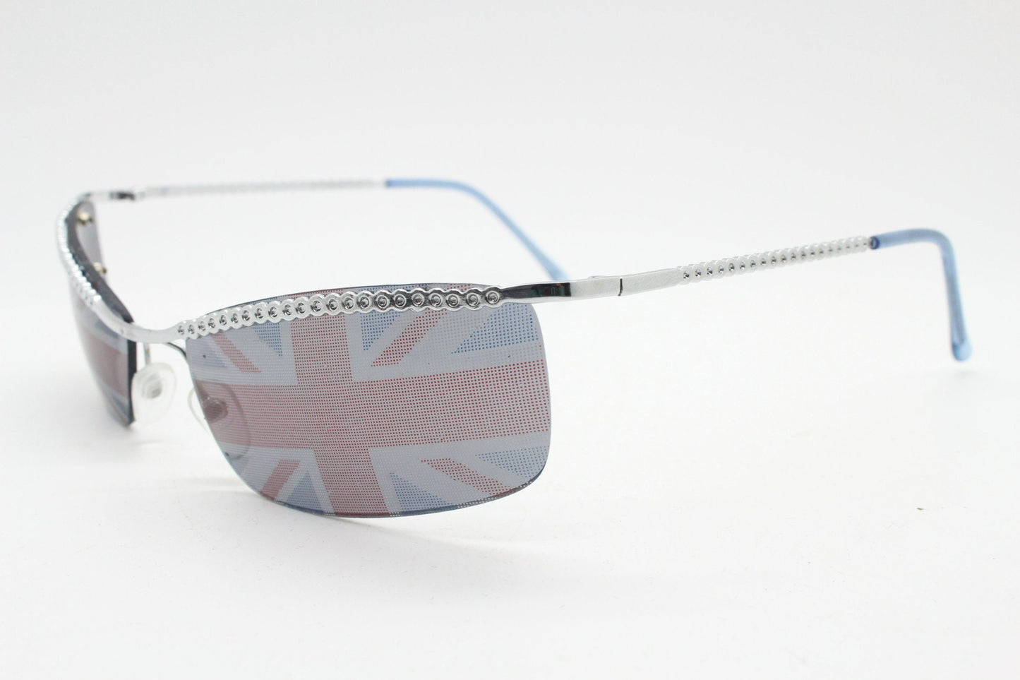 90s vintage half frame Union Jack sunglasses. Curved lens suspended on a sparkling chrome brow. Unused NOS. Brit pop girl power