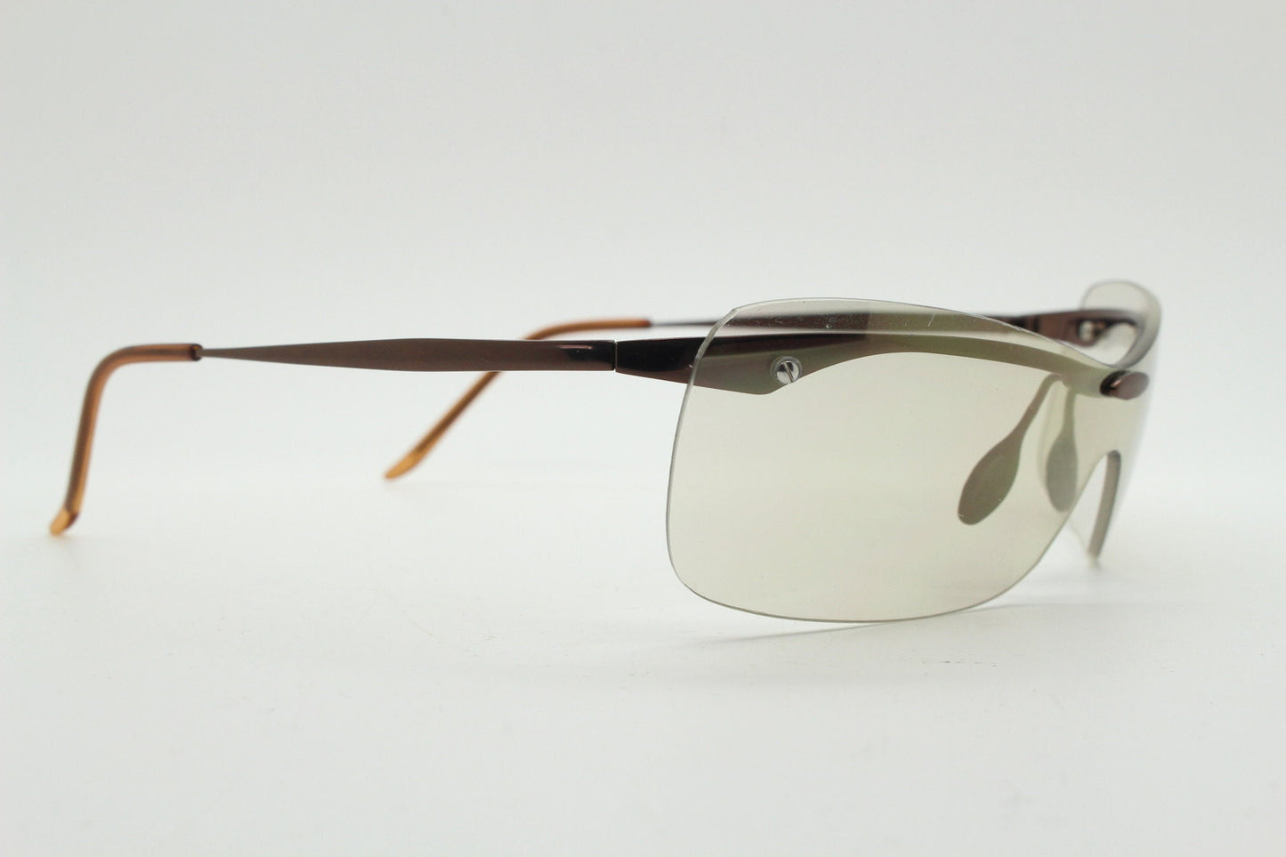 Y2K vintage visor sunglasses. 2000's wrap around sport shield design. Brown chrome brow with light tone lens. NOS 00's. 90S