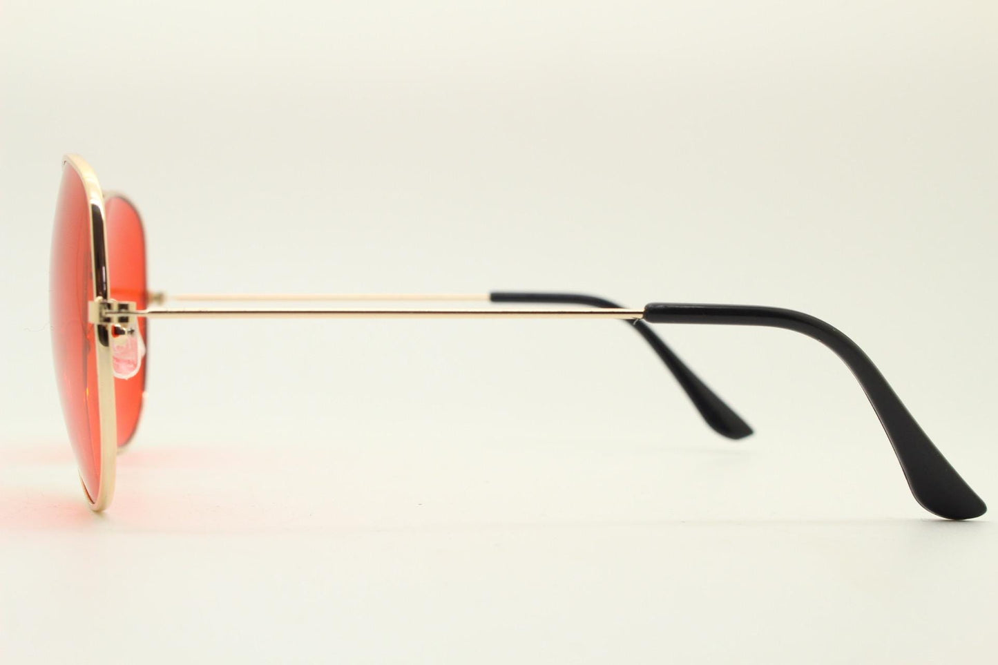 Y2K vintage teardrop aviator sunglasses. Gold chrome metal frame 70s design aviators with intense red lenses. 2000s. Unused NOS