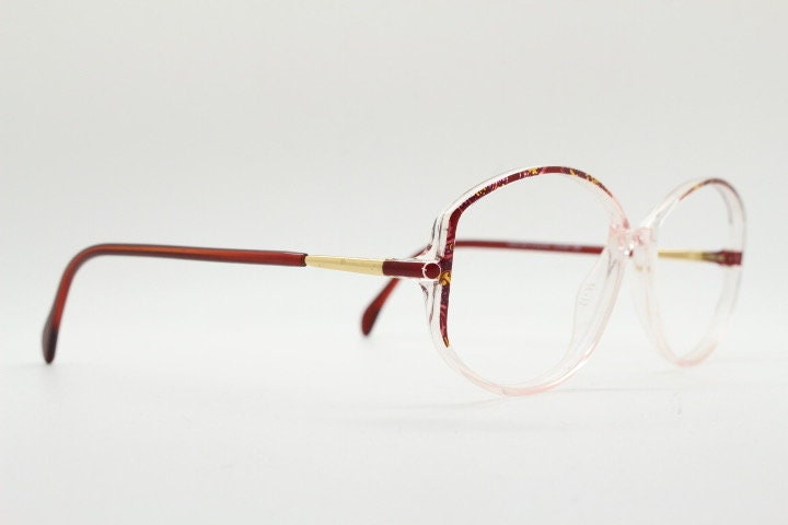 Silhouette 80s vintage hexagon eye glasses made in Austria. Transparent crystal optical frame with abstract red pattern. Prescription RX