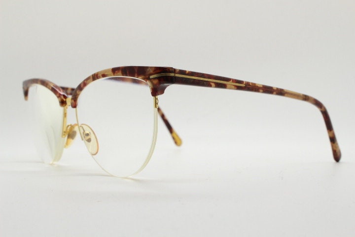 Versace 90s vintage brow line cat eye glasses made in Italy. Elegant tortoise acetate cateye optical half frames. Prescription RX eyeglasses