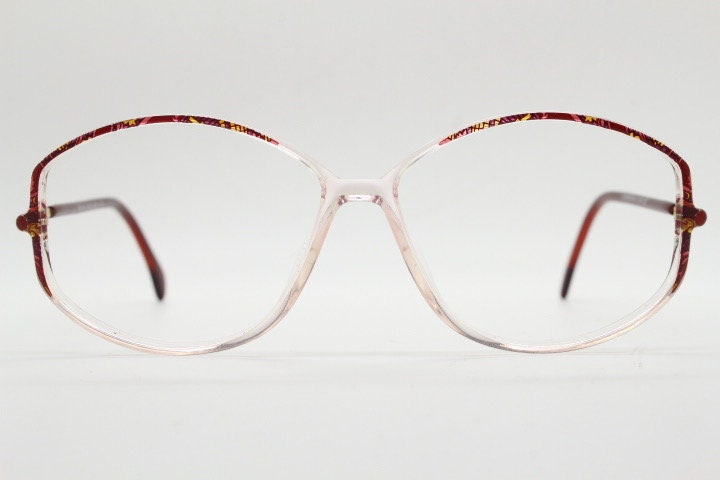 Silhouette 80s vintage hexagon eye glasses made in Austria. Transparent crystal optical frame with abstract red pattern. Prescription RX
