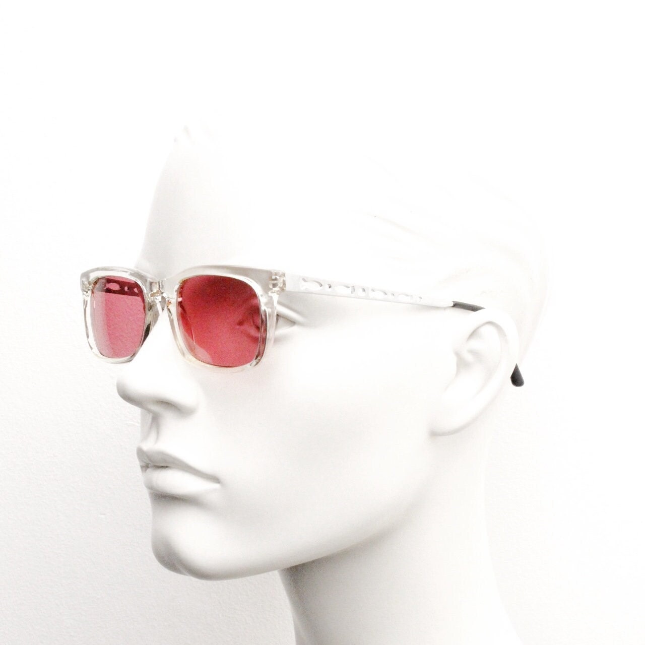 90s vintage futuristic crystal  sunglasses. Rectangular transparent frame with extraordinary arm cut outs and shocking pink lenses. NOS