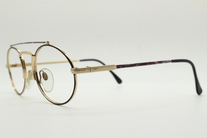90s vintage oval eye glasses. Gold metal optical frame with vibrant enamel pattern and prominent double bridge. Prescription spectacles. NOS