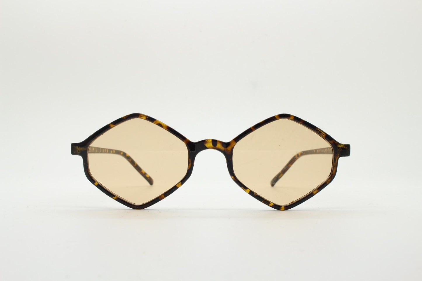 90s vintage diamond hexagon sunglasses. Atmospheric 6 sided tortoise gloss frame with very light tone brown lenses. Unused NOS