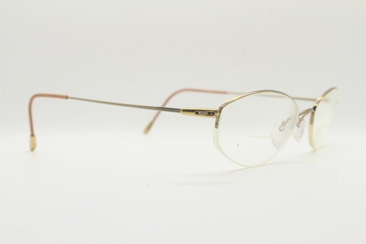 Silhouette oval half frame eye glasses model 6608 made in Austria. Minimal optical frame with extremely flexible wire arms. Prescription RX