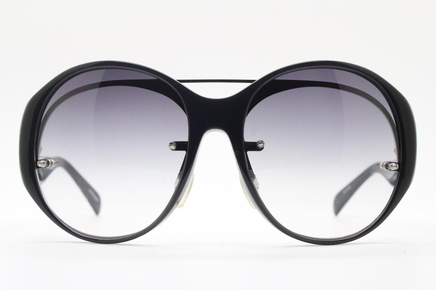 Jens Laugesen oversized sunglasses hand made by Linda Farrow. Black frame with undulating arms and smoky lenses. 70s design. Vintage. NOS