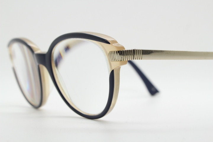 Nina Ricci vintage cat eye glasses. Yellow crystal and black acetate cateye optical frames gold metal arms. Womens prescription spectacles