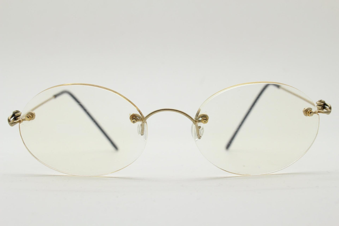 TRY vintage oval frameless eye glasses made in Italy. Futuristic minimal lightweight gold titanium optical frame. RX Spectacles