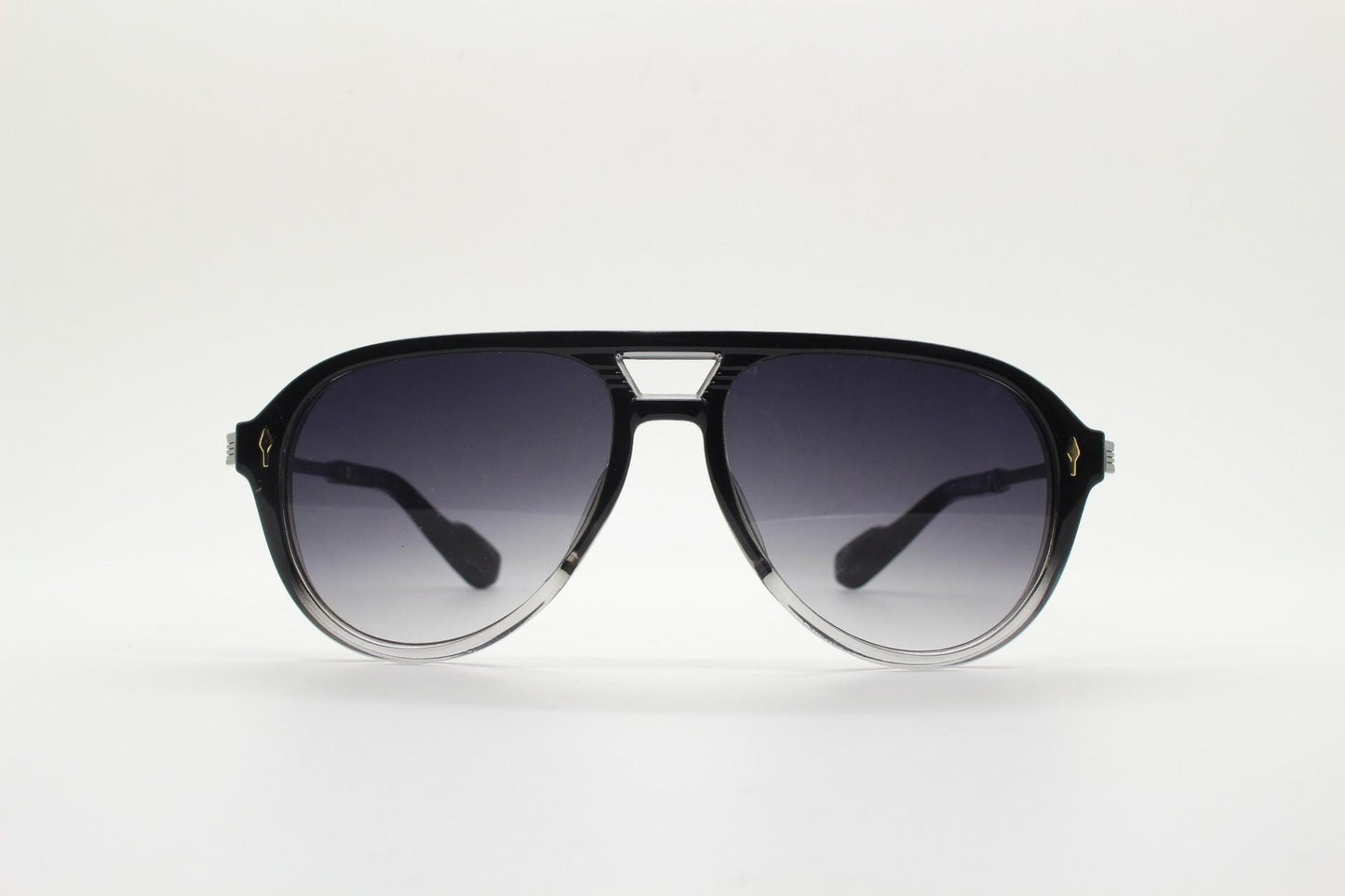 Y2K vintage transparent black aviator sunglasses. Well proportioned teardrop shape with graduating lenses and grey metal embossed arms. NOS