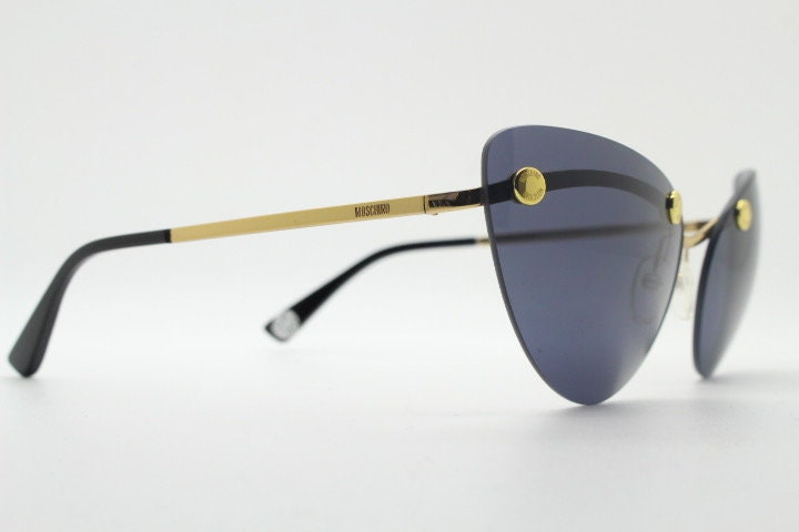 Moschino oval cat eye sunglasses model 082/S. Womens frameless cateye in perfect proportions with golden metal brow line
