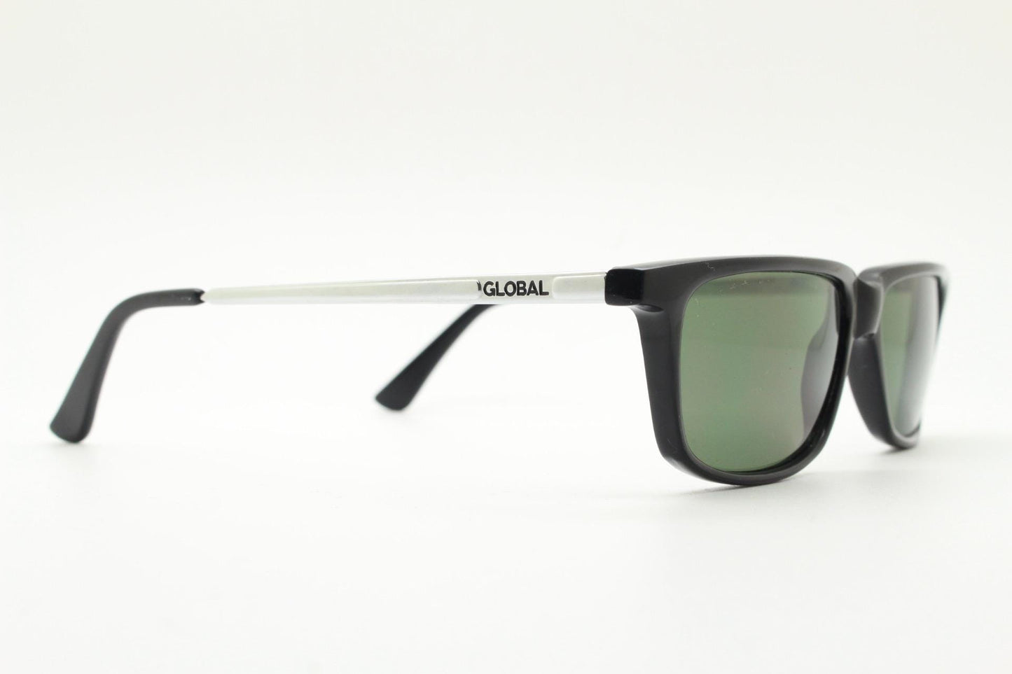 Global Eyewear vintage 90s vintage rectangular low profile sunglasses model 4330. Black flat top frame with silver chrome arms. NOS