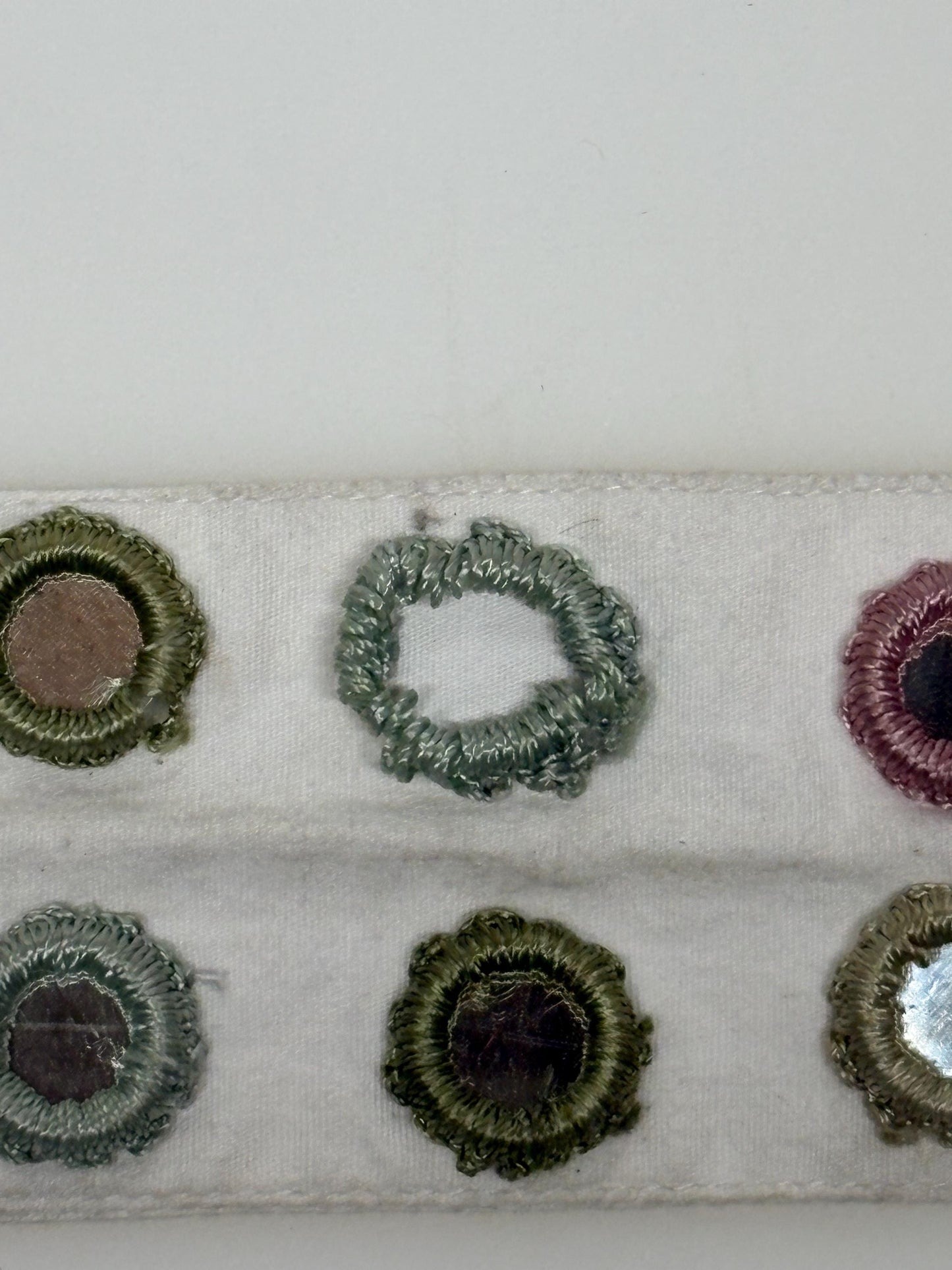 Y2K vintage womens dress belt by Stephanie Hirsch. White with pink and green embroidered little frames around mirror circles. 2000s. BNWT