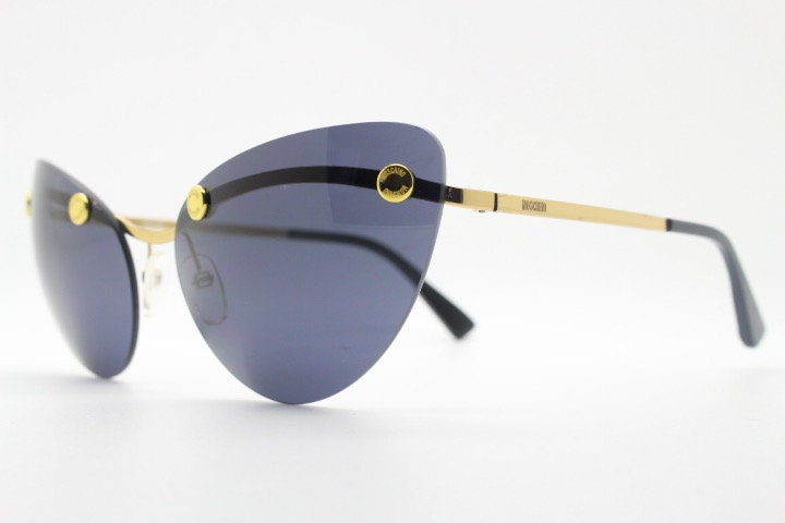 Moschino oval cat eye sunglasses model 082/S. Womens frameless cateye in perfect proportions with golden metal brow line
