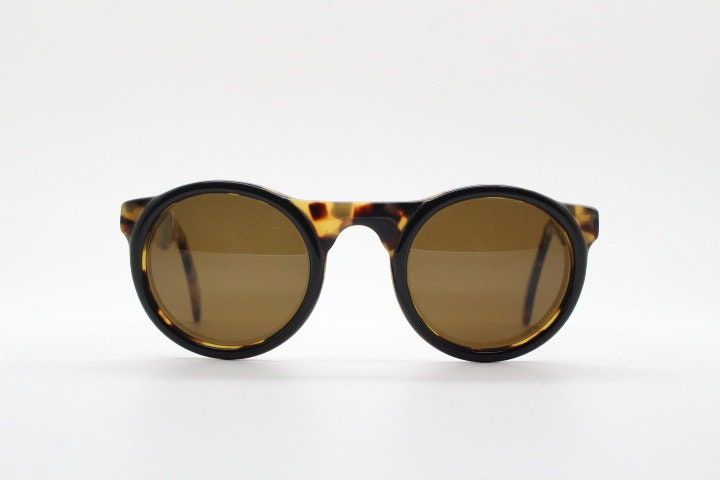Francois Pinton Paris 90s vintage round sunglasses made in France. Womens thick acetate frame in honey tortoise brown tones. NOS