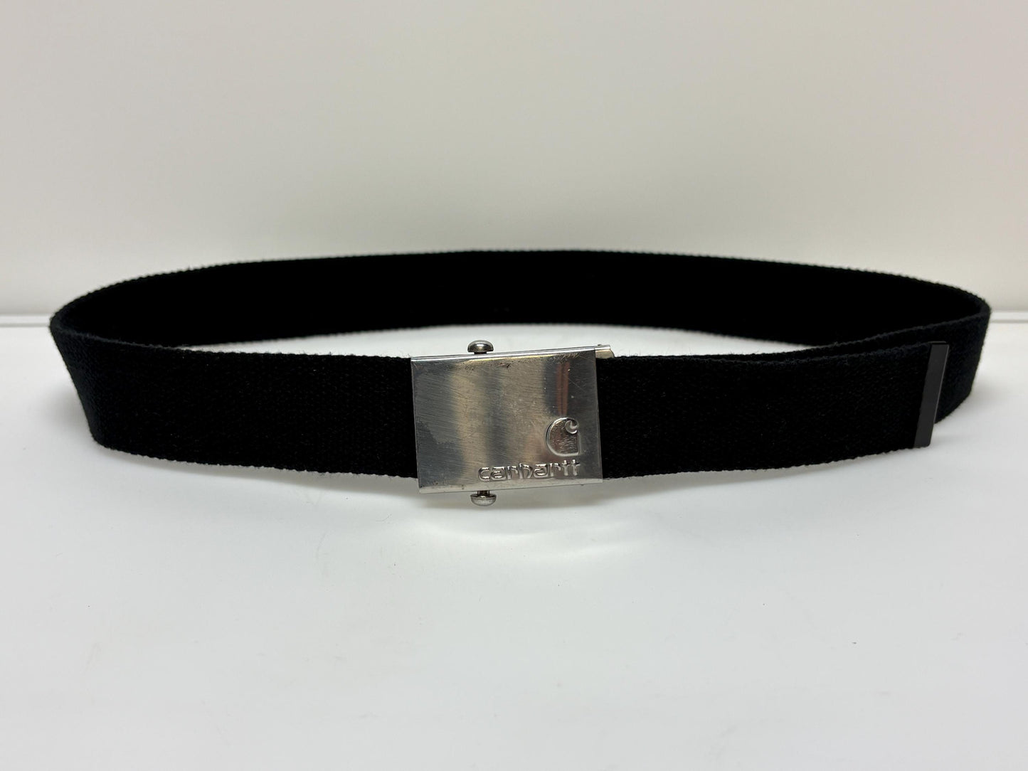 Carharrt vintage canvas army style belt buckle with 2 belts . One black plus one khaki green. no holes format. Slide lock . Fully adjustable