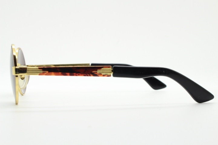 Optical City 90s vintage small round undersized sunglasses made in Italy. Handsome metallic tiger pattern on quality 1920s repro frame. NOS