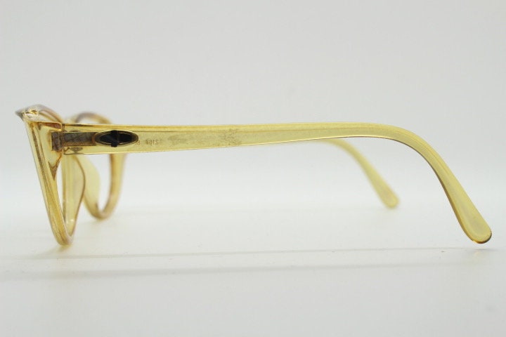 Christian Dior 80s vintage flat top cat eye glasses made in Germany. Transparent yellow optical frame with abstract print. Prescription RX