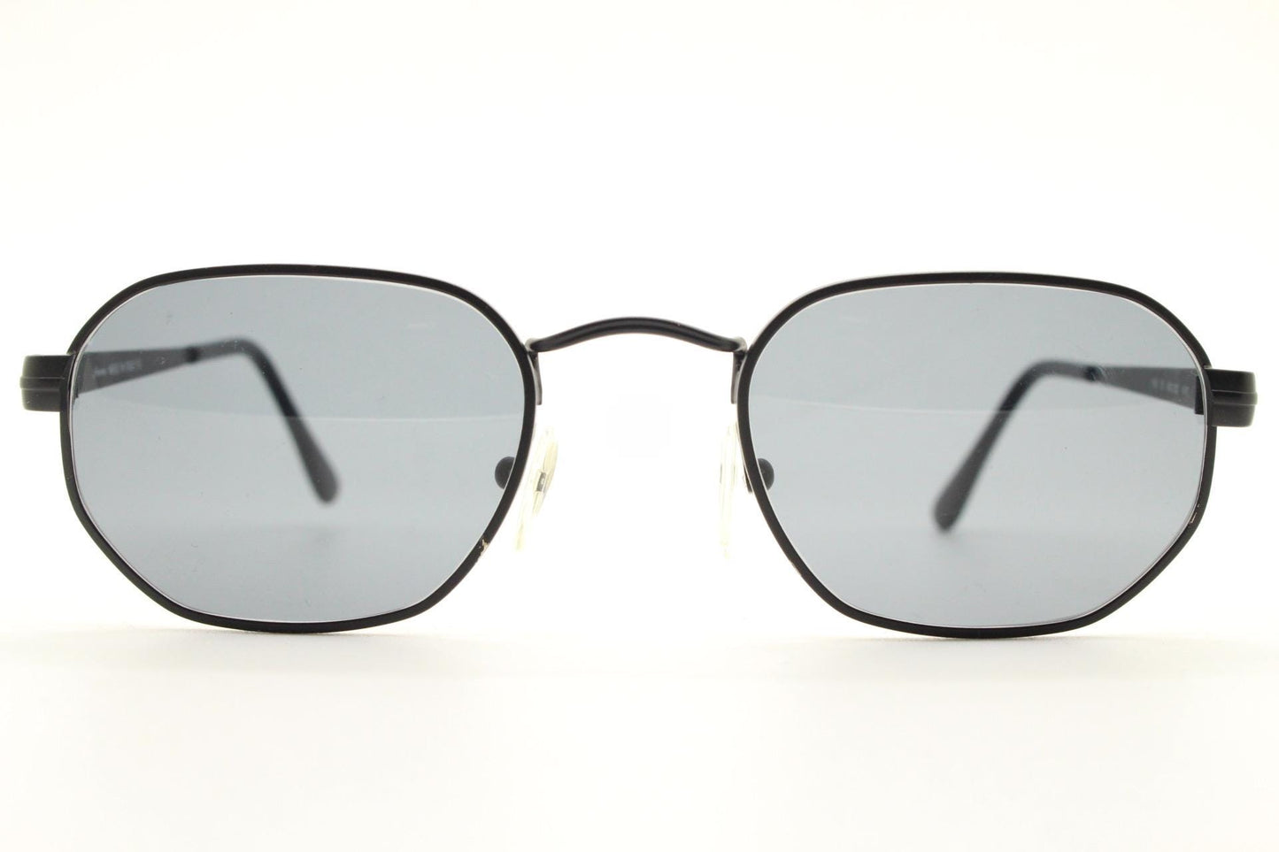 Prestige 90s vintage small oval sunglasses model 119 made in Italy. Black matt metal frame with with subtle angular facets, NOS octagon