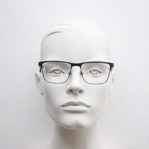 Calvin Klein rectangular eye glasses. Gunmetal grey chrome wire optical frames with black matt brow. Prescription eyeglasses. RX Spectacles