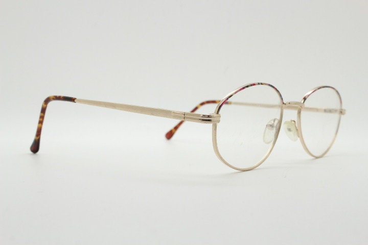 90s vintage oval eye glasses. Bright golden optical frames with coloured enamel brows. Prescription RX spectacles. Clear lens NOS