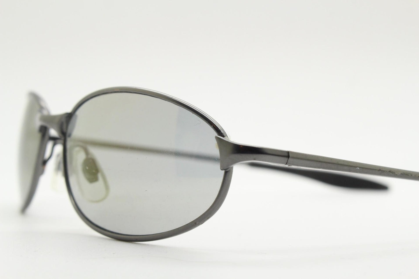 90s vintage oval small  bug eye sunglasses. Satin finish frame in gunmetal with straight spear arms. Y2K. 2000s. Unworn NOS