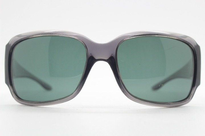 Polaroid Y2K vintage shield sunglasses. Transparent grey wrap around with red diamante LOVE logo and polarising lens. 2000s. Rhinestone