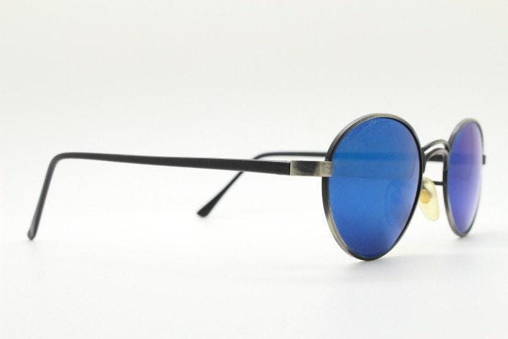 90s vintage oval panto sunglasses. Brushed bronze metal frame with cool blue mirror lenses and black slender arms. Unused NOS
