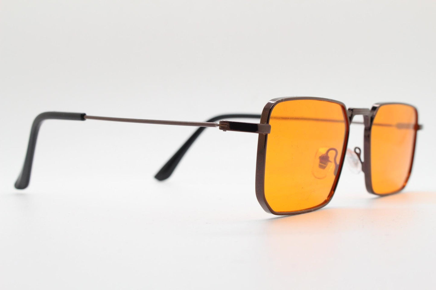 90s vintage angular 6 sided sunglasses. Brown chrome metal frame with blazing flat orange lenses. Rectangular psychedelic sunnies. BNWT