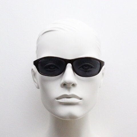 Y2K vintage wrap around shield sunglasses. Brown aerodynamic high gloss frame with black curved lenses. 2000's sport. New Old Stock 90s