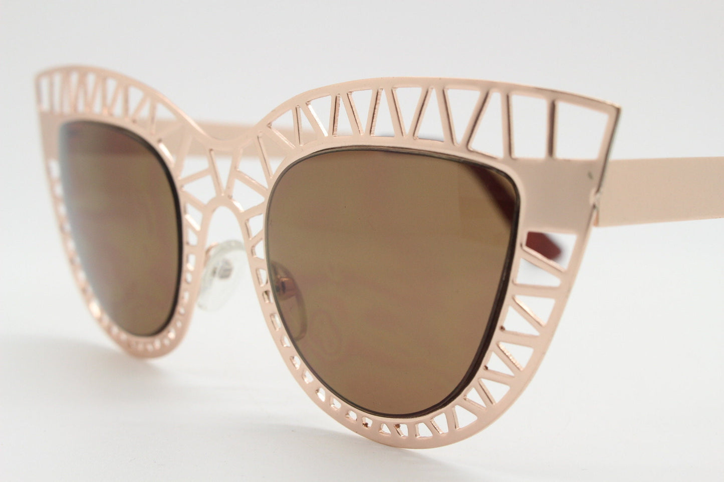 Y2K vintage metal cat eye sunglasses.  Women's extraordinary gold cut out lattice scaffold cateye frame with brown lenses. 2000s. BNWT