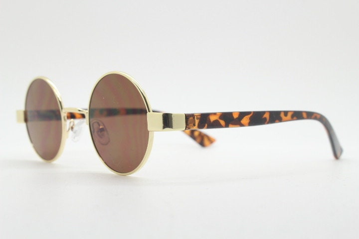 90s round vintage sunglasses. Gold 1920's style frame with tortoise arms and brown lenses. Unused. NOS. Steampunk
