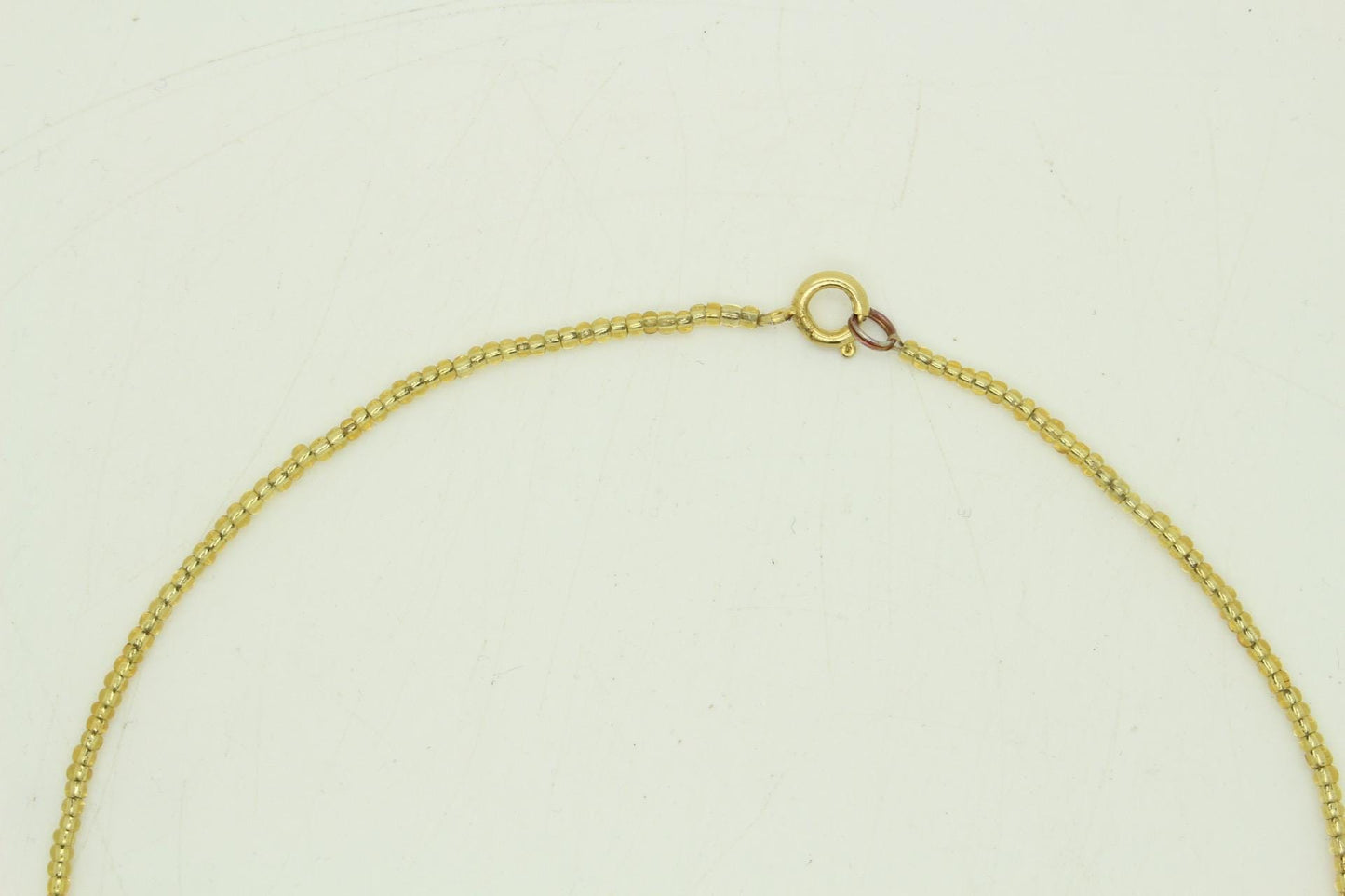 80s vintage gold beaded necklace with large dangling leaves . Charming statement piece. Country and western. Native american
